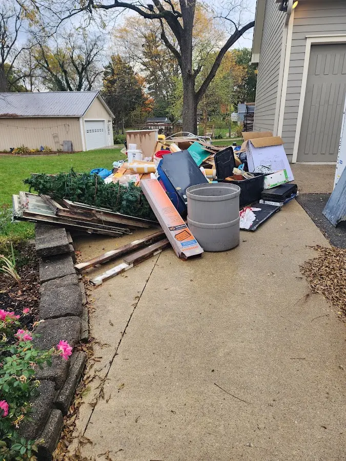 Dumpster being loaded with debris for Roofing Dumpster Rental in Prosser